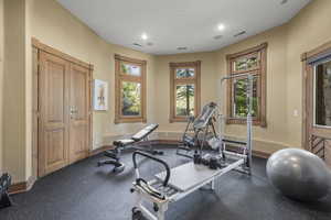 Exercise area featuring baseboards and recessed lighting