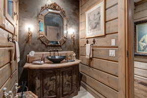 Half bathroom featuring vanity