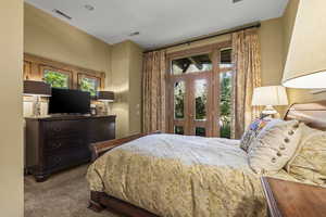 Carpeted bedroom featuring access to outside