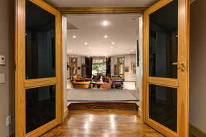 Corridor with recessed lighting, wood finished floors, and a sauna