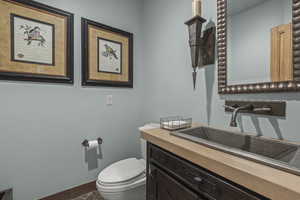 Bathroom featuring vanity and dark tile patterned floors