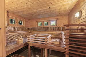 Relaxing sauna / steam room with wooden ceiling and wood walls