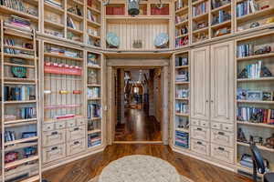 Office space featuring dark wood-type flooring