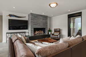 Living area with a fireplace and recessed lighting