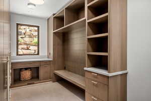 Mudroom featuring light tile patterned floors