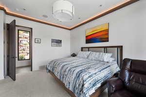 Carpeted bedroom with baseboards
