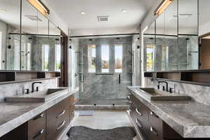 Full bathroom featuring backsplash, vanity, a stall shower, tile patterned floors, and recessed lighting