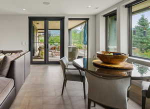 Entryway with plenty of natural light, recessed lighting, and french doors
