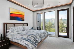 Bedroom with carpet and access to exterior