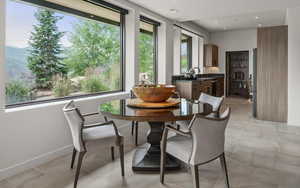 Dining area with a mountain view and recessed lighting