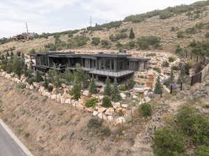 Back of property with stairway and a deck
