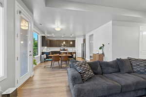 Living room featuring light wood-style floors and recessed lighting