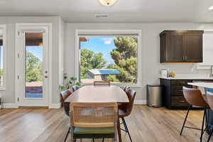 Dining room with light wood-style floors