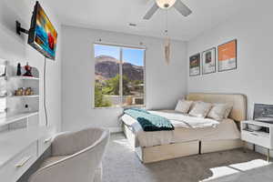 Bedroom with carpet flooring and ceiling fan
