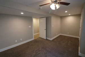 Unfurnished room with recessed lighting, dark carpet, and a ceiling fan