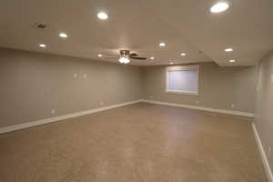 Empty room with recessed lighting and a ceiling fan