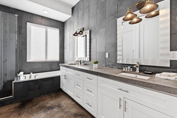 Full bathroom featuring a bath and a stall shower