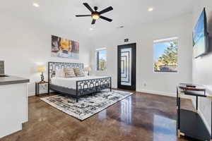 Bedroom with concrete floors, recessed lighting, and access to exterior