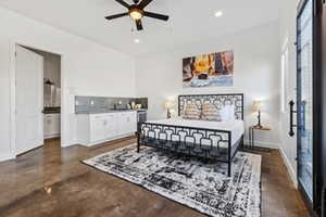 Bedroom featuring recessed lighting and concrete floors