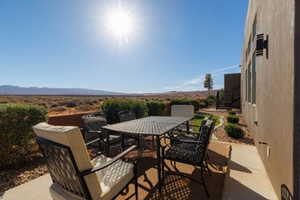 View of patio with outdoor dining area