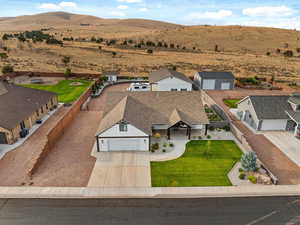 Aerial perspective of suburban area with a mountainous background