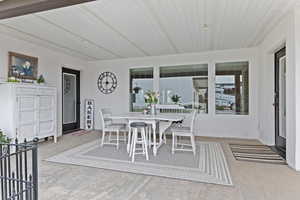 Dining space featuring light colored carpet