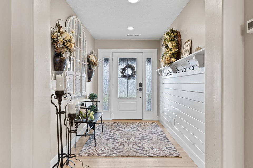 Mudroom with light wood-type flooring and recessed lighting