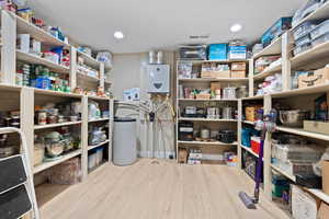 Storage featuring tankless water heater