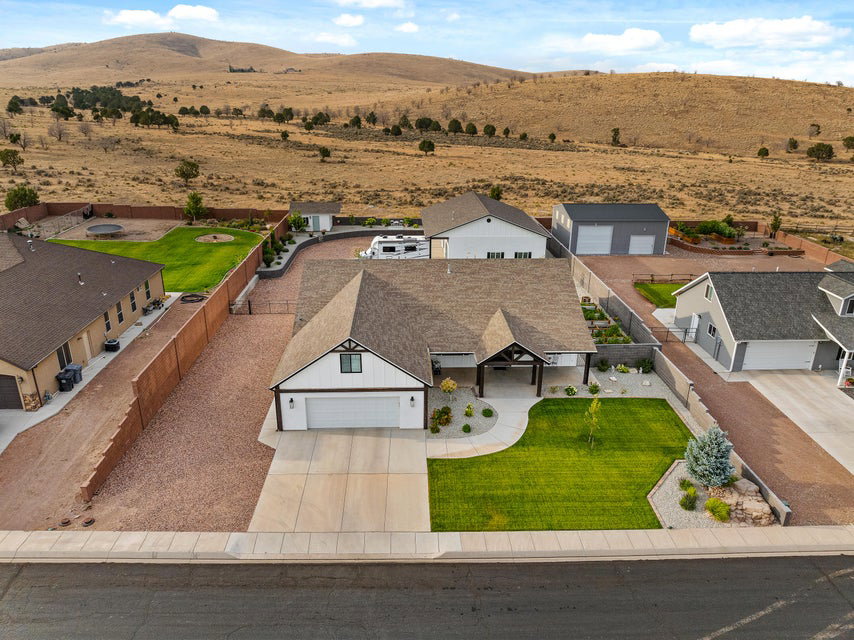 Aerial perspective of suburban area featuring a mountainous background