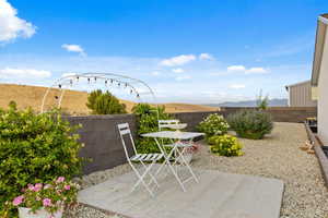 Fenced backyard with a patio and a mountain view