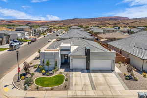 Aerial perspective of suburban area featuring a mountainous background