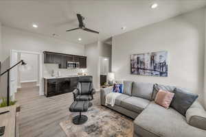 Living area featuring recessed lighting, light wood-type flooring, and a ceiling fan