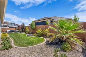 Fenced backyard with an outdoor hangout area