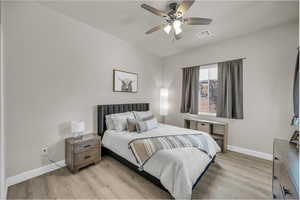 Bedroom with light wood-type flooring and ceiling fan