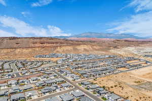 Aerial view of residential area with a mountainous background and a desert landscape