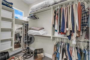 Spacious closet with wood finished floors