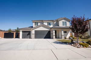 View of front of home featuring a tile roof, a porch, concrete driveway, stone siding, and stucco siding