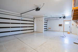 Garage featuring a garage door opener