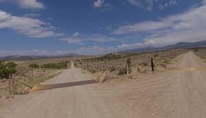 View of street with a view of rural / pastoral area and a mountain view