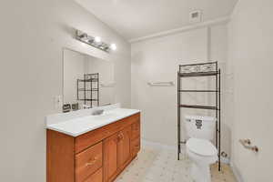 Bathroom featuring a textured ceiling, vanity, and tile patterned floors