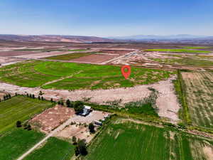 Aerial view of property's location featuring rural landscape and a mountain backdrop