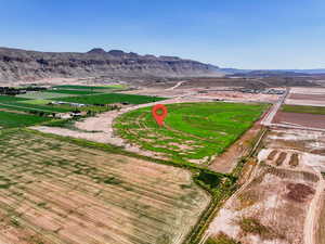 Aerial view of property and surrounding area with rural landscape and large plots for crops