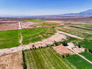 Aerial view of property's location with rural landscape and mountains