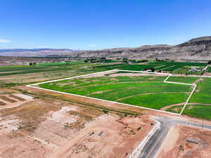 Aerial view of property's location with a mountainous background and property parcel outlined