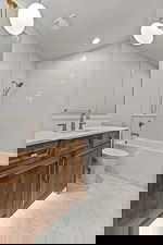 Full bathroom with vanity and shower / washtub combination