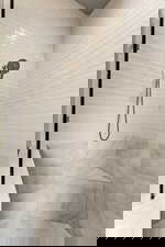 Bathroom featuring a tile shower