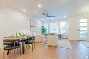 Dining area featuring light wood-style flooring, recessed lighting, and ceiling fan