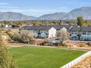 View of mountain backdrop featuring nearby suburban area