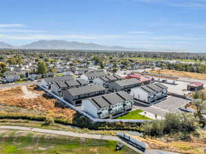 Aerial perspective of suburban area with a mountainous background