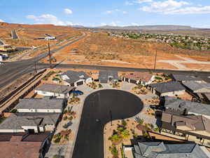Aerial perspective of suburban area featuring a mountain backdrop